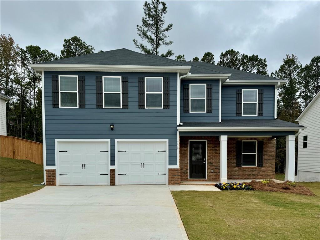 front view of a house with a yard