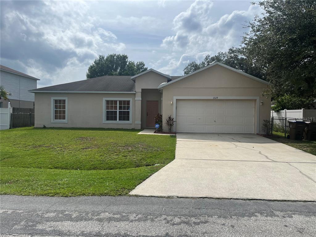 a front view of a house with garage