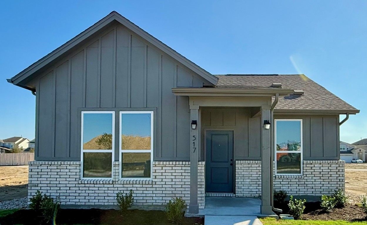 a front view of a house with glass windows