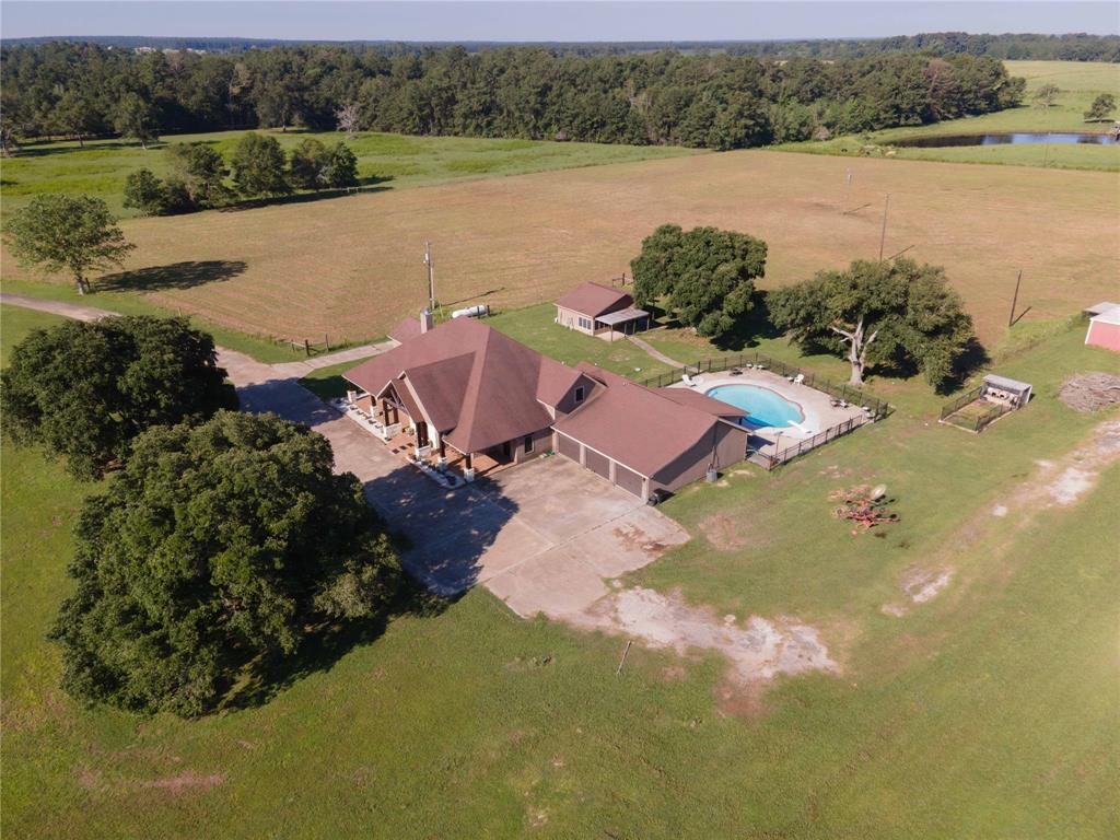 an aerial view of a house with lake view