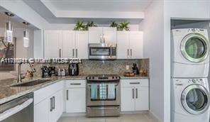 a kitchen with a stove and a sink