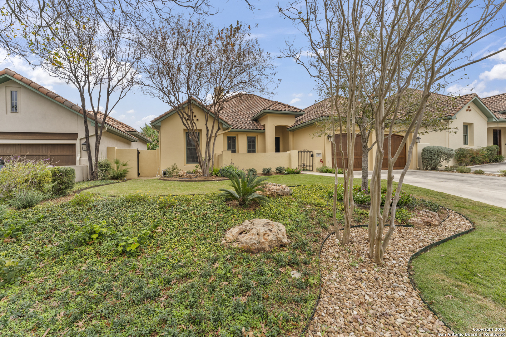 a front view of a house with garden