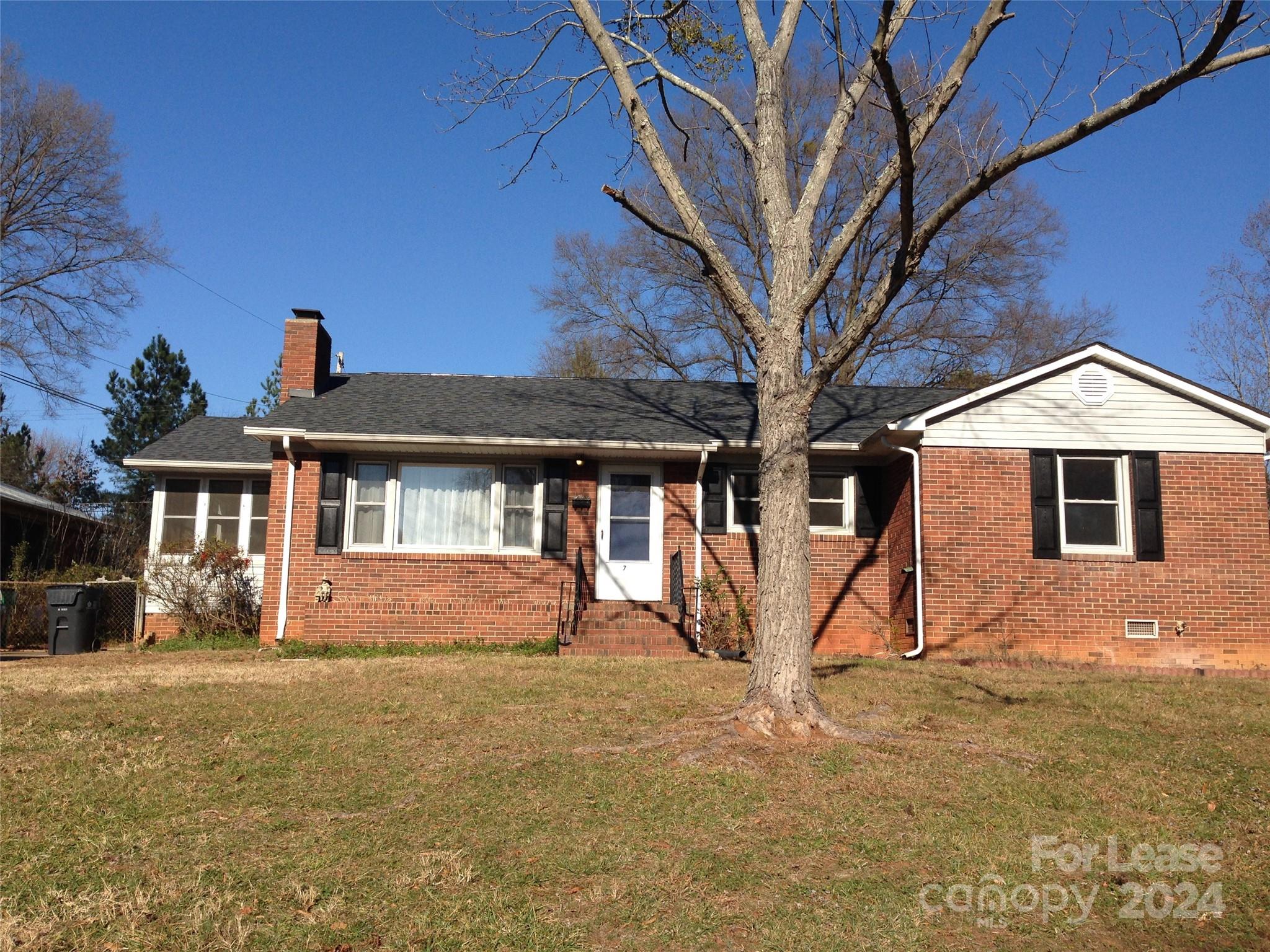 a front view of a house with parking yard