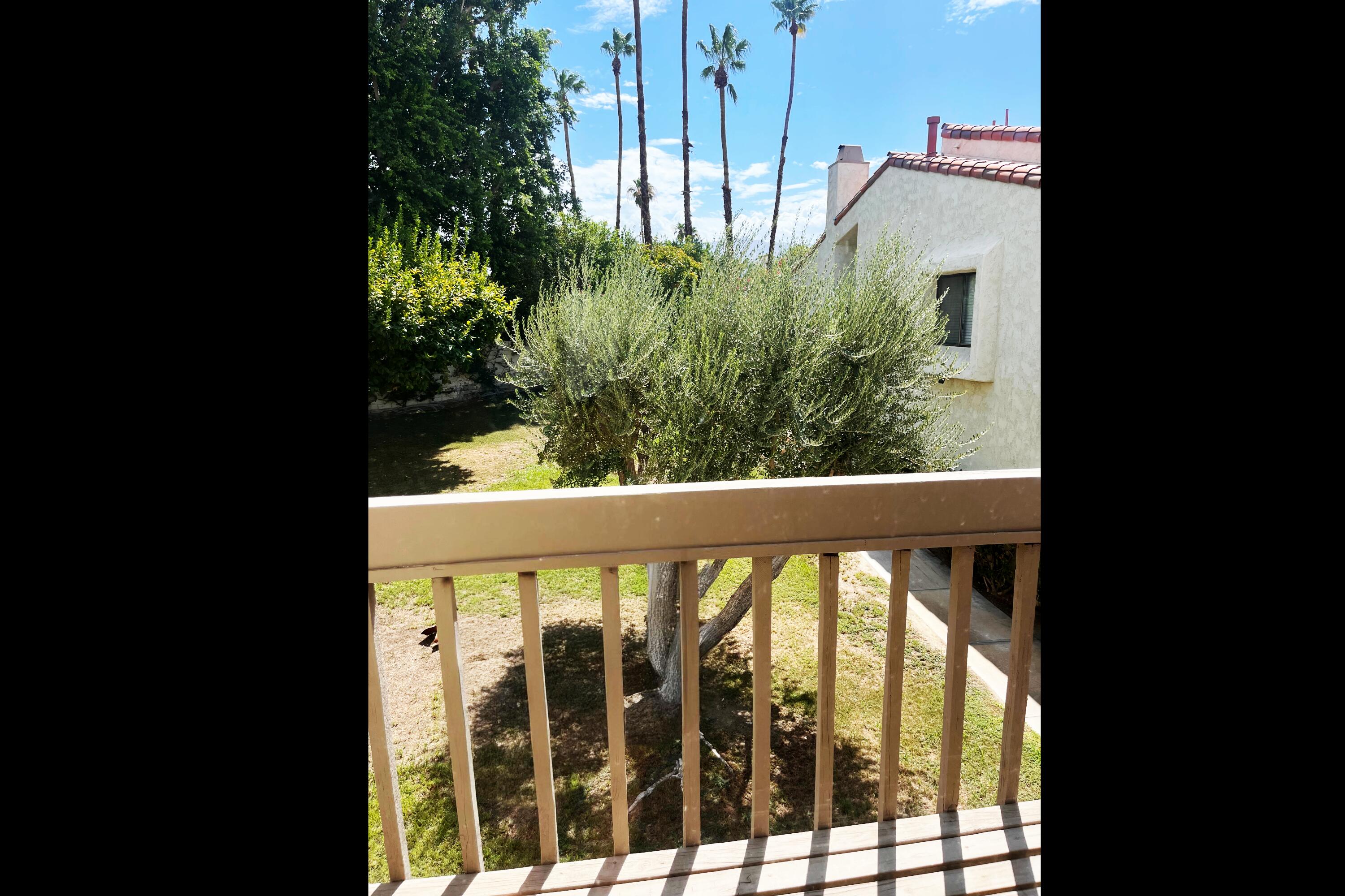 a view of a balcony with plants