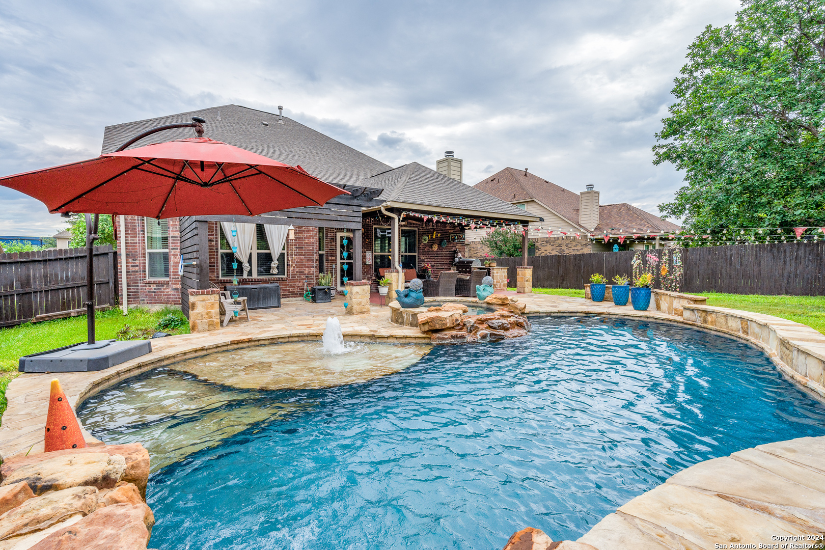 a view of a swimming pool with a patio