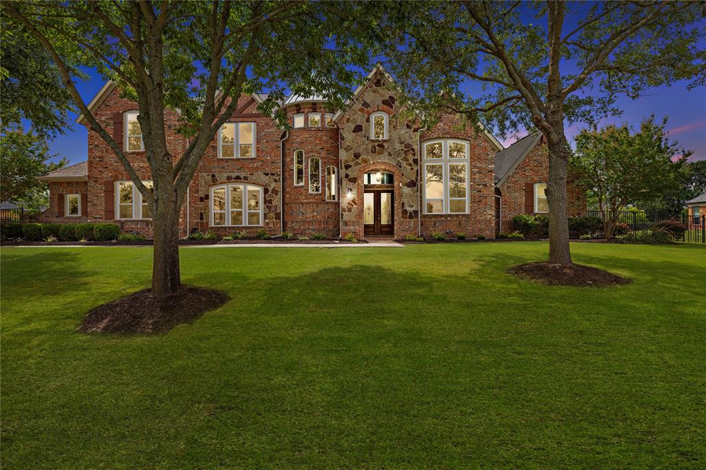 a large building with trees in front of it