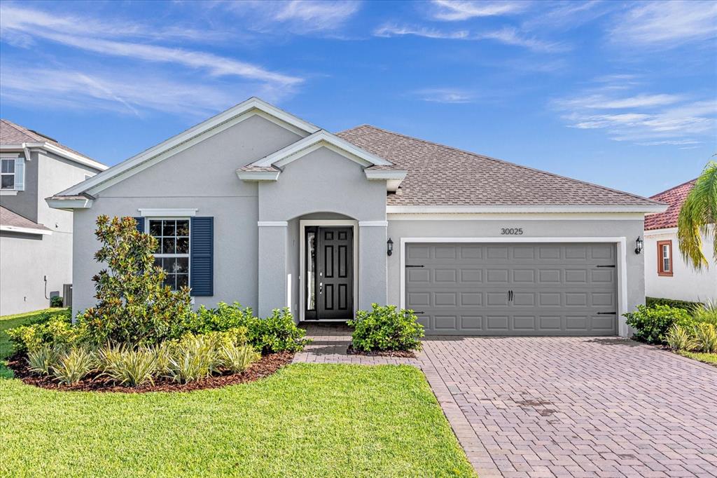 a front view of a house with a yard