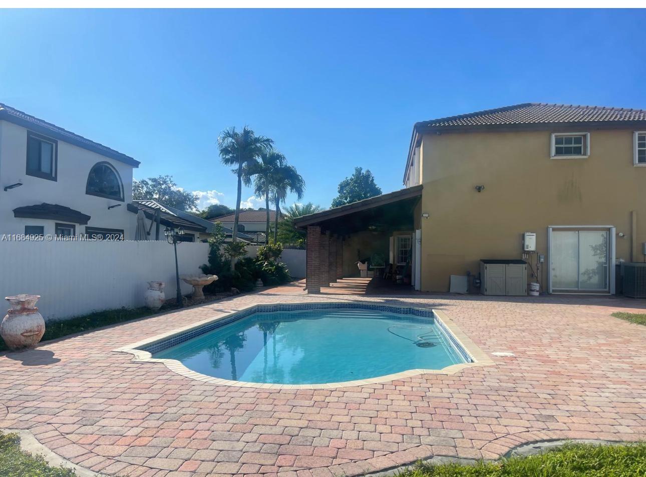 a view of a swimming pool with a patio