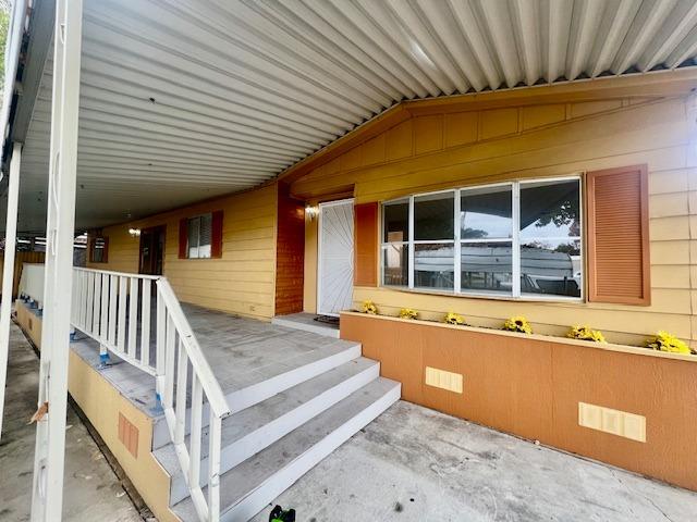 a view of a house with wooden deck