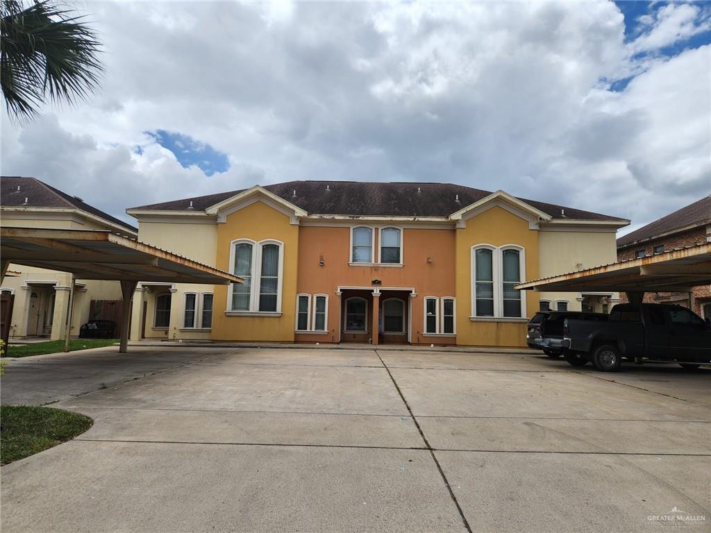 a view of a car park in front of house