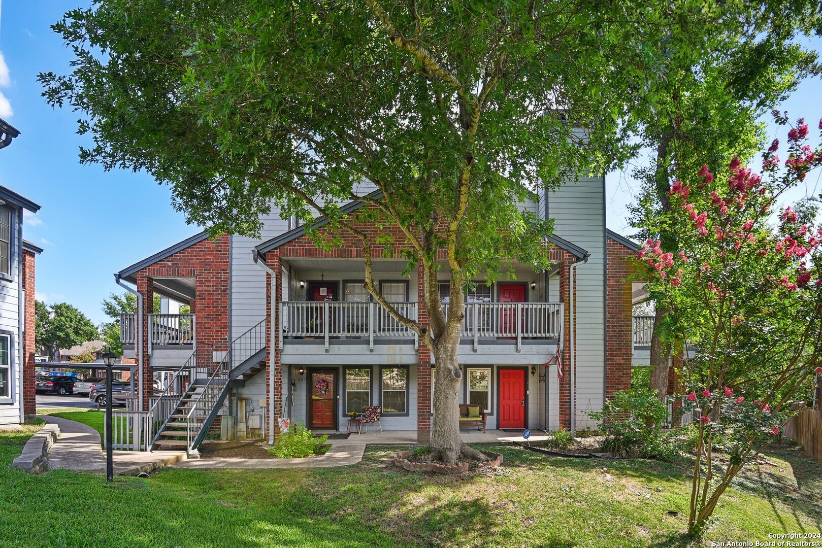 a front view of a house with yard