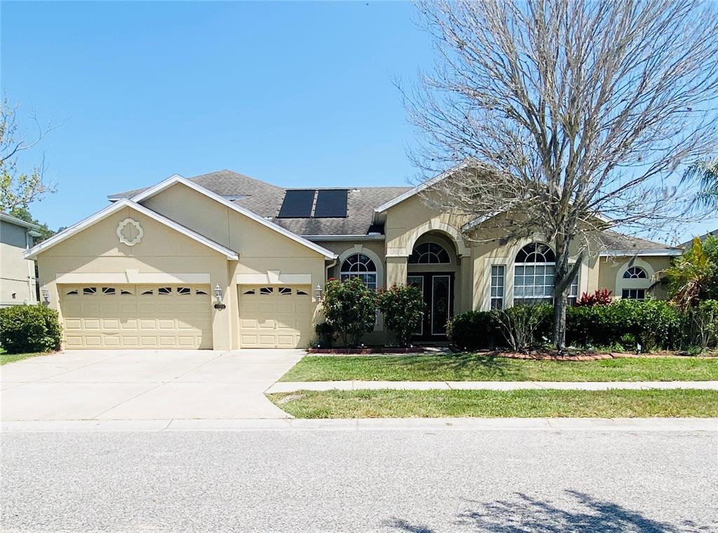 a front view of a house with a yard