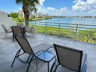 a view of a chairs and table in the patio