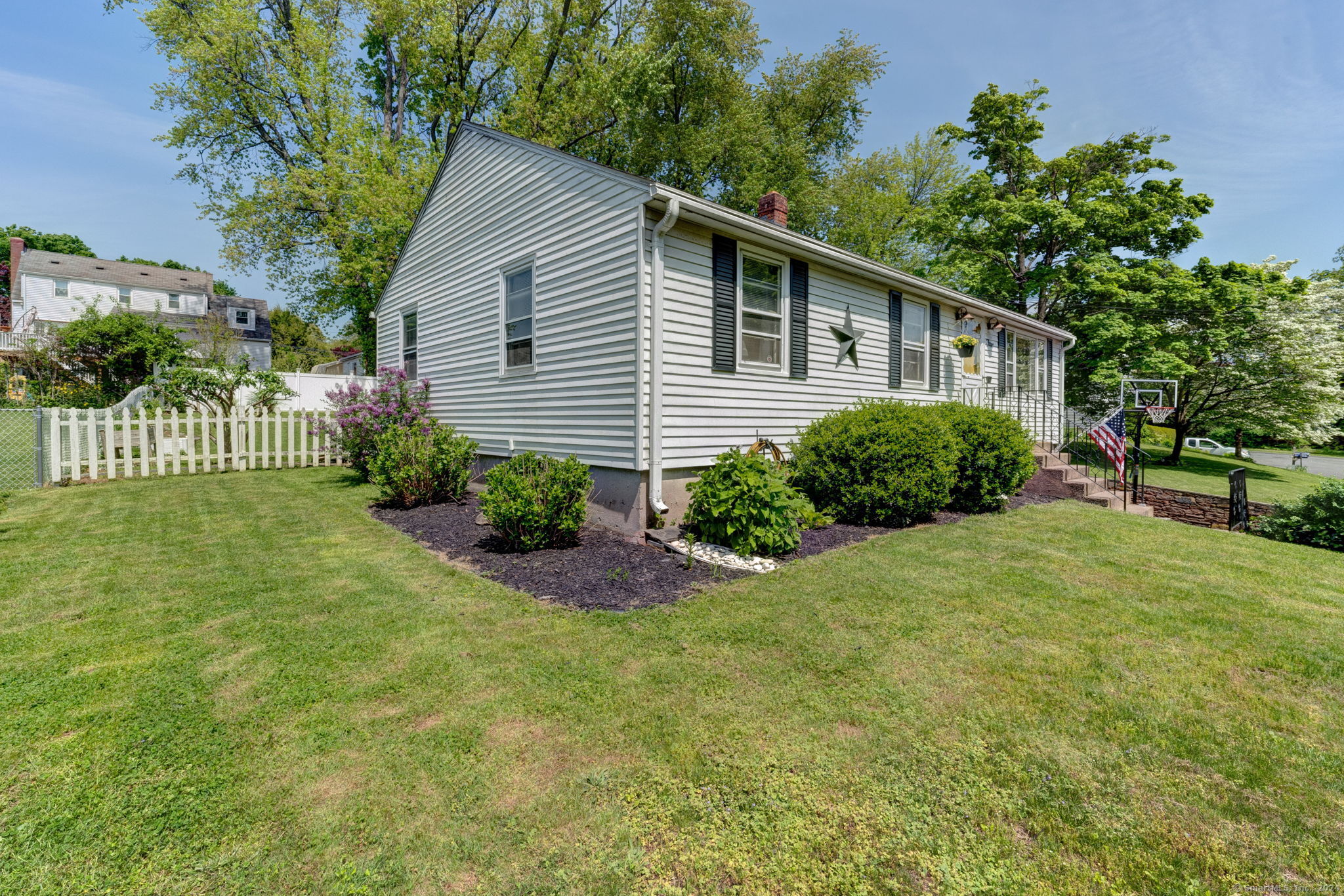 a front view of a house with garden