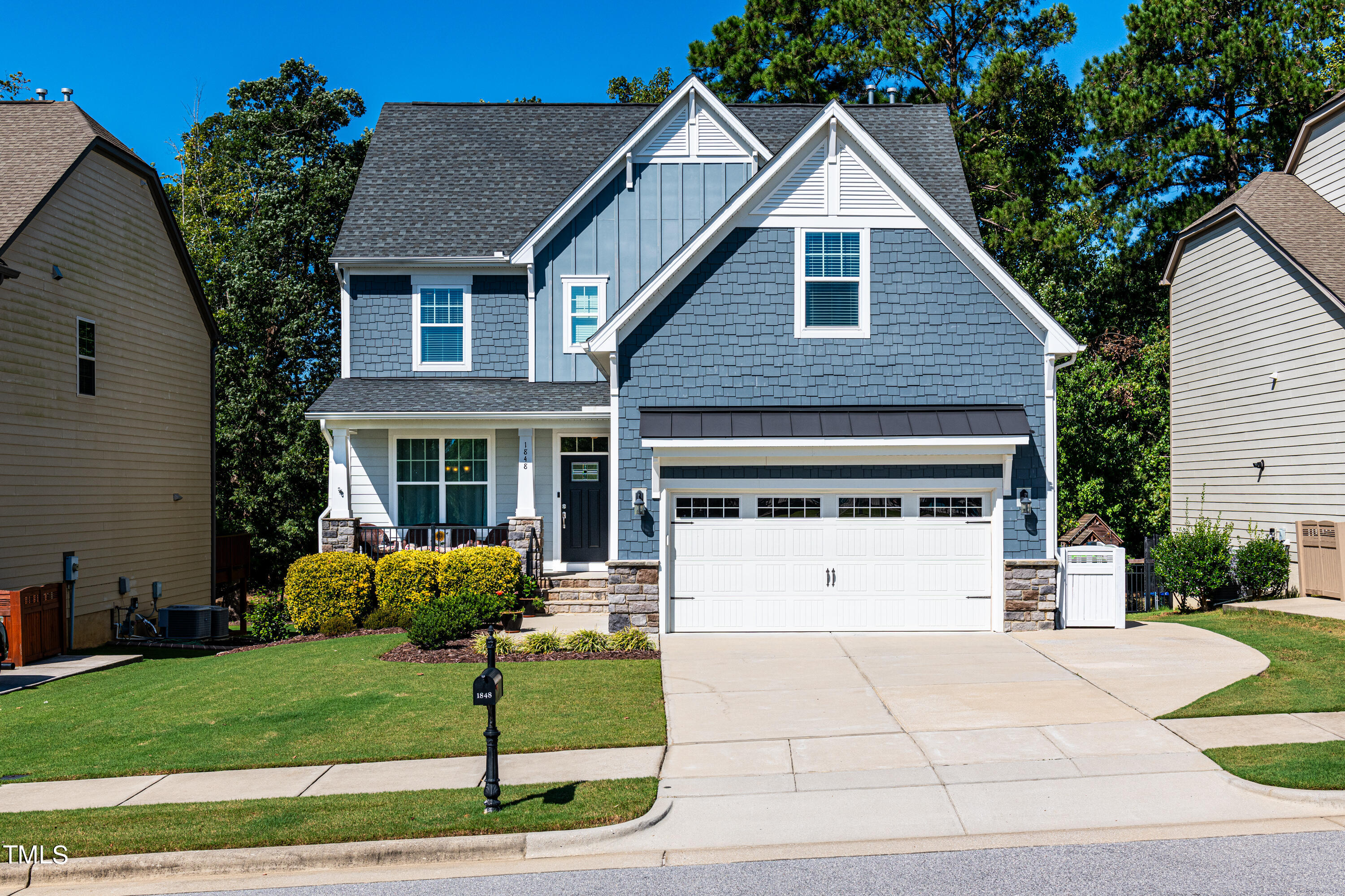 a view of a yard in front view of a house