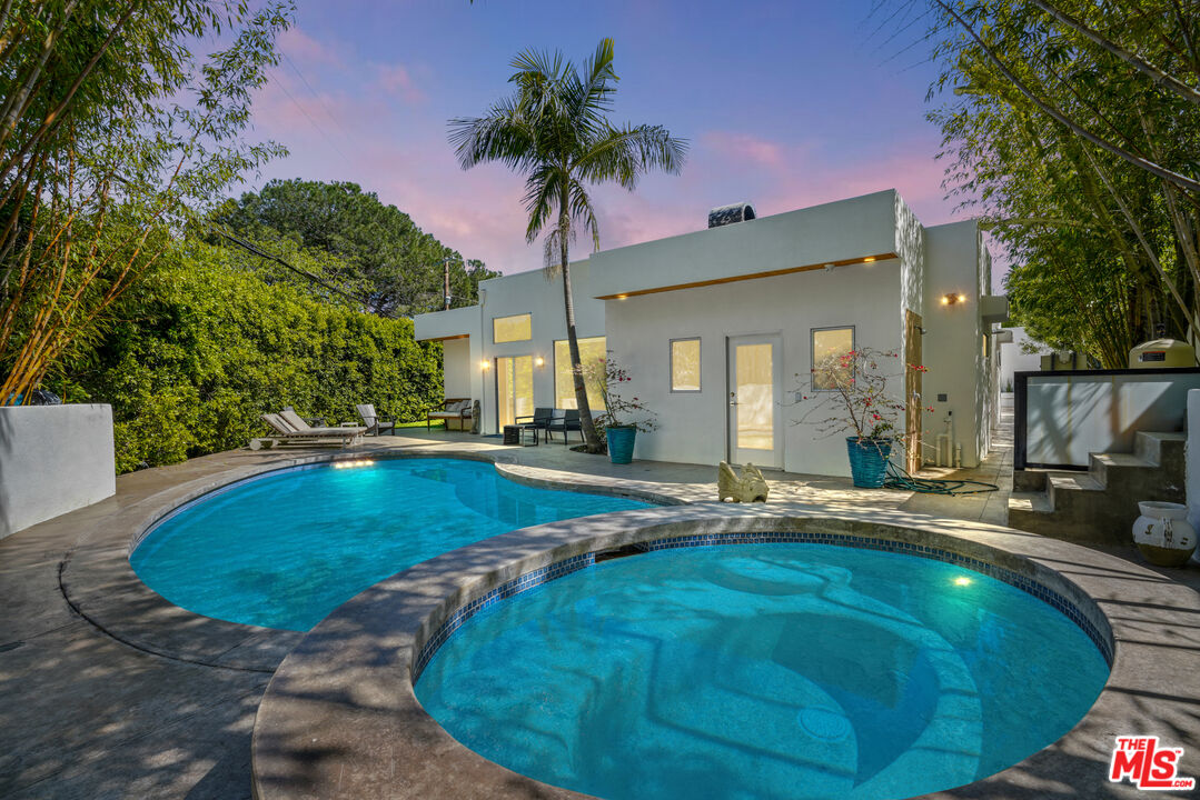 a view of a house with swimming pool