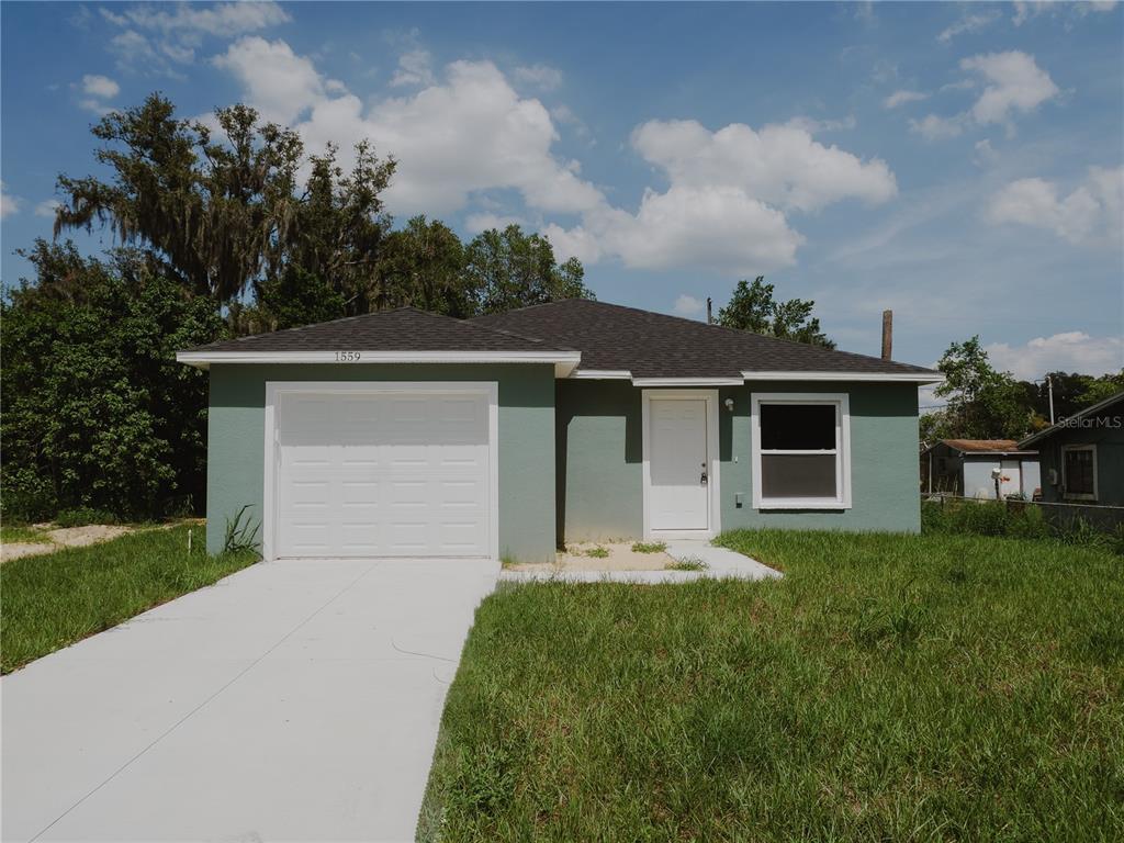 front view of a house with a yard