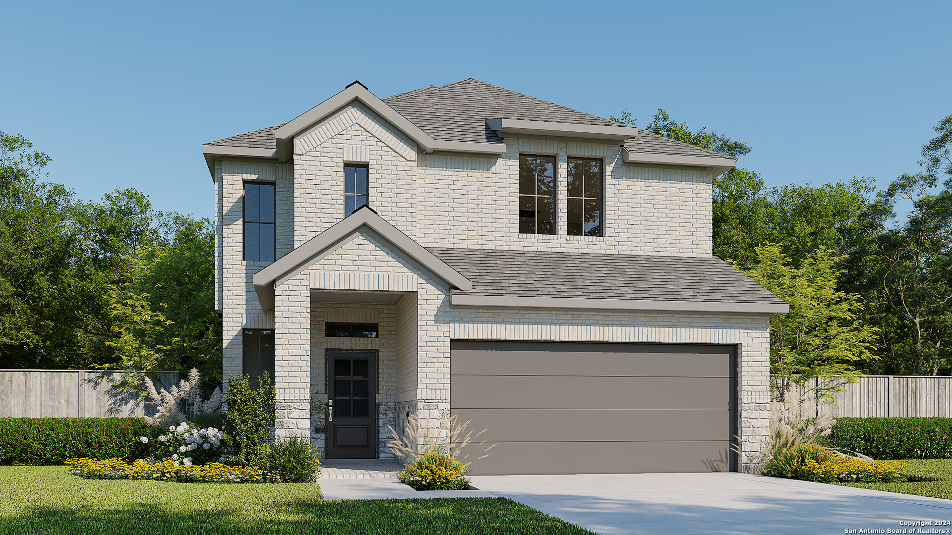 a front view of a house with a yard and garage