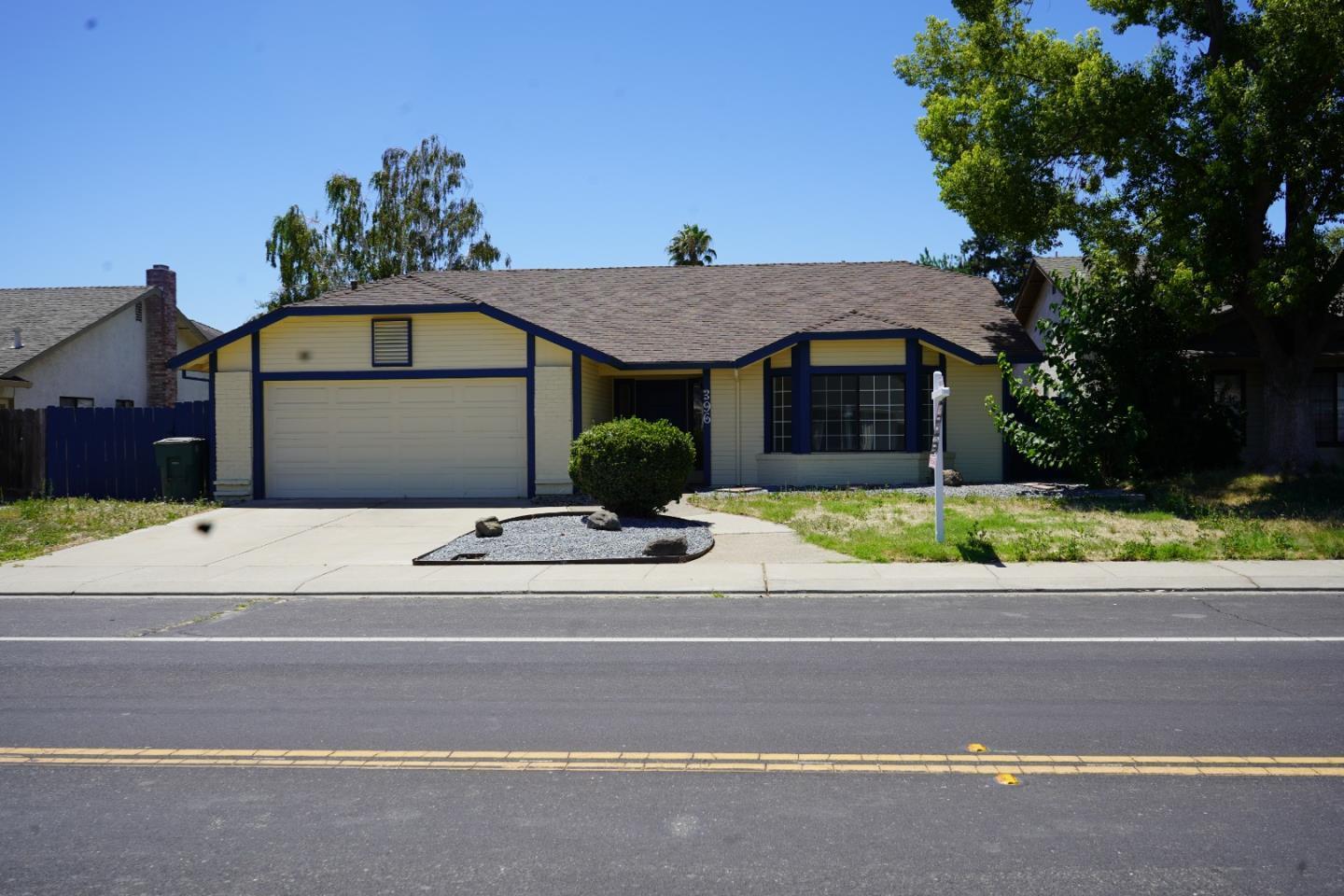 a front view of a house with a yard