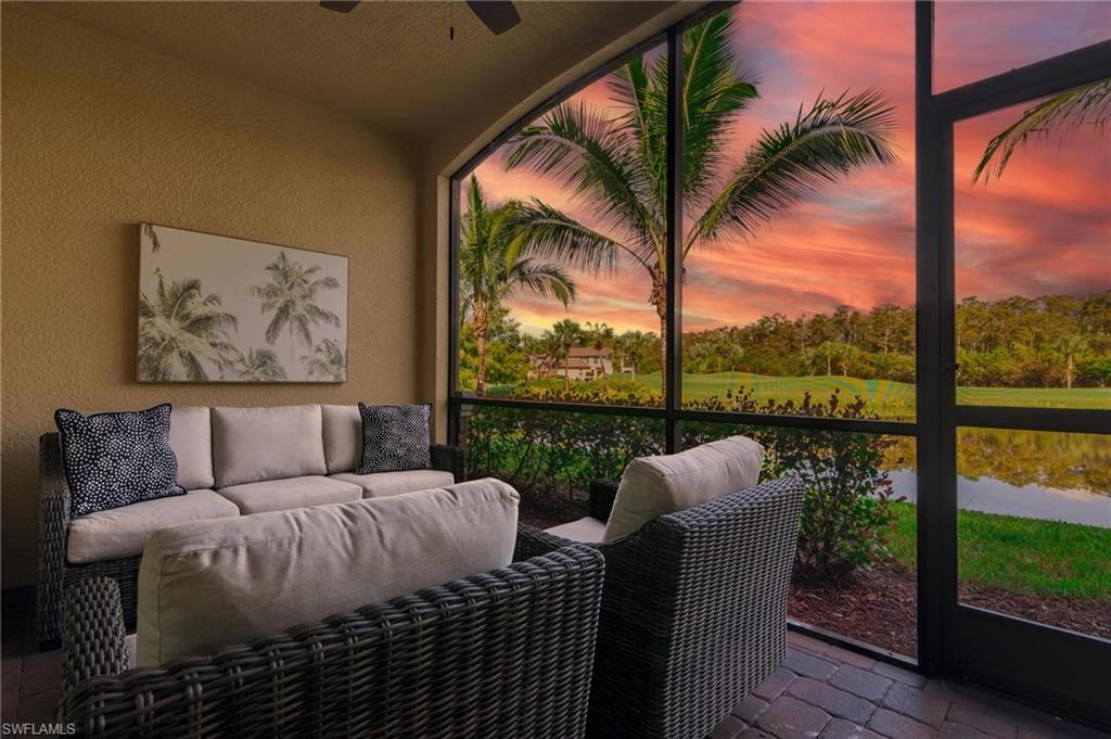 a view of a porch with furniture and yard