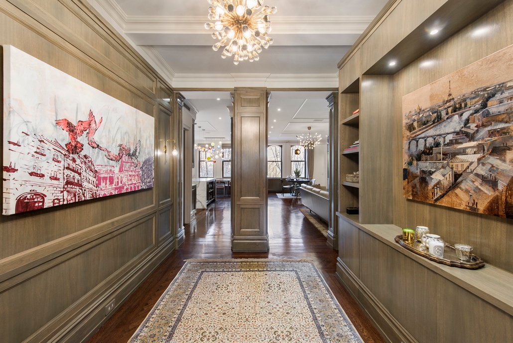 a lobby with furniture and a rug