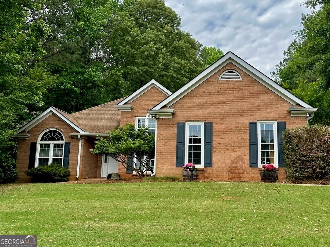 a front view of a house with a yard