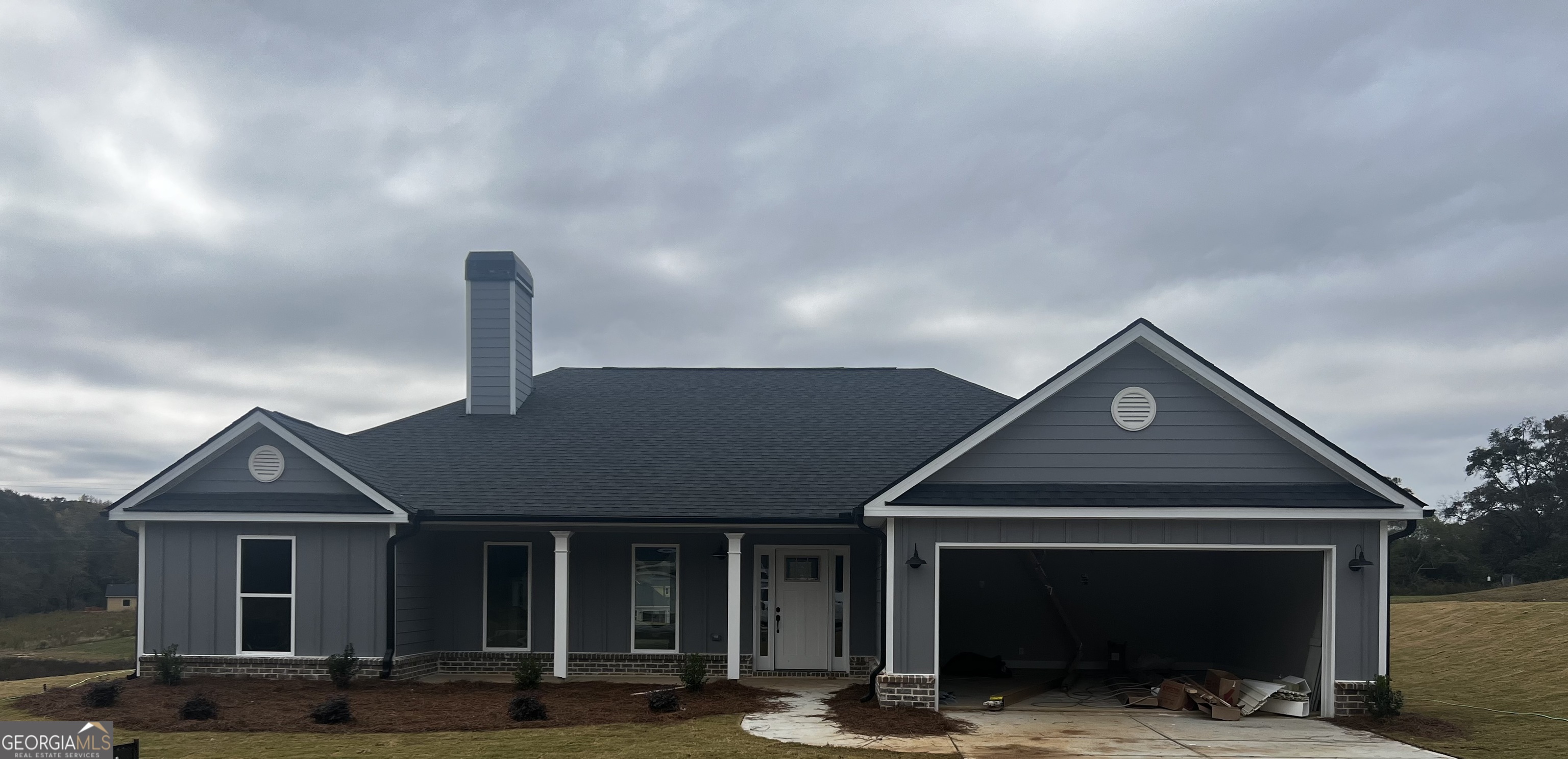 a front view of a house with a porch