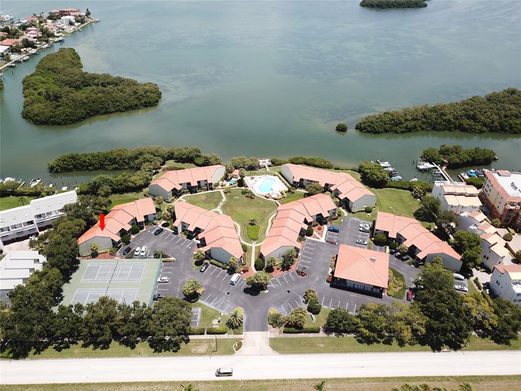 an aerial view of a house with yard swimming pool and outdoor seating