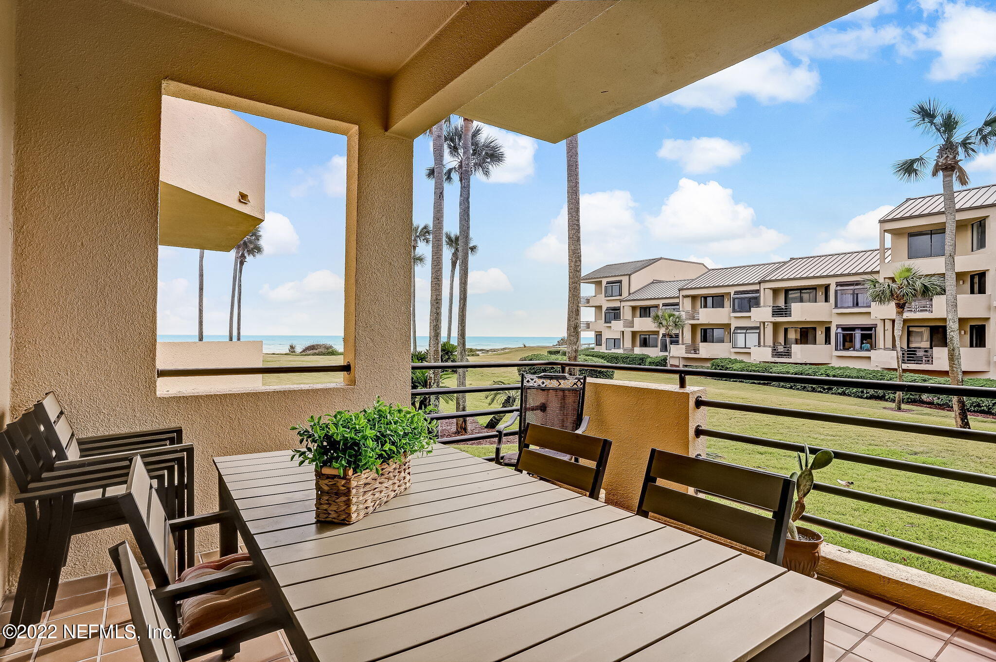 a view of a balcony with chairs