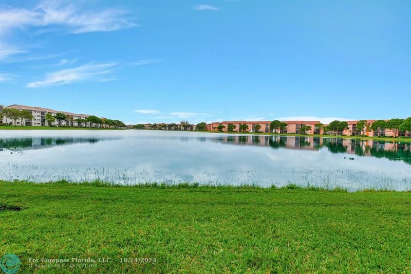 a view of a lake with houses in the back