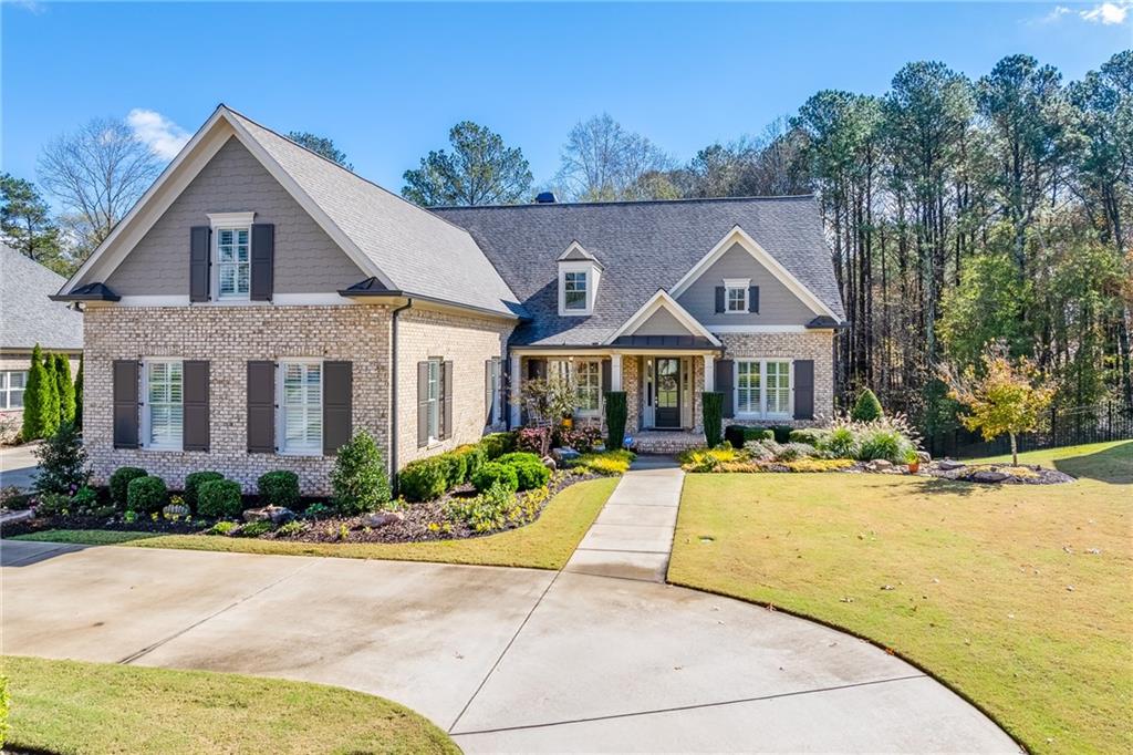 a front view of house with yard outdoor seating and green space