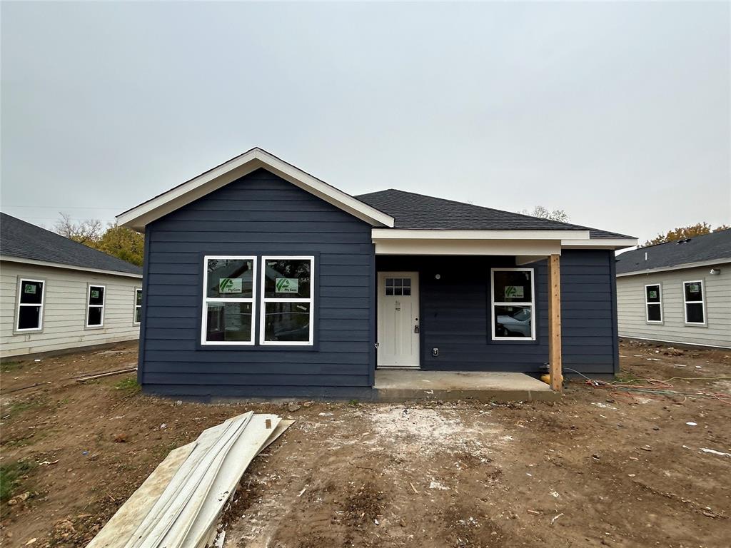 front view of a house with a yard