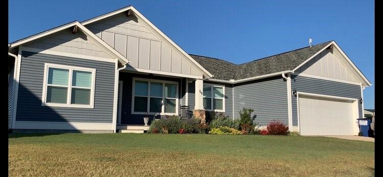 a view of a house with a yard