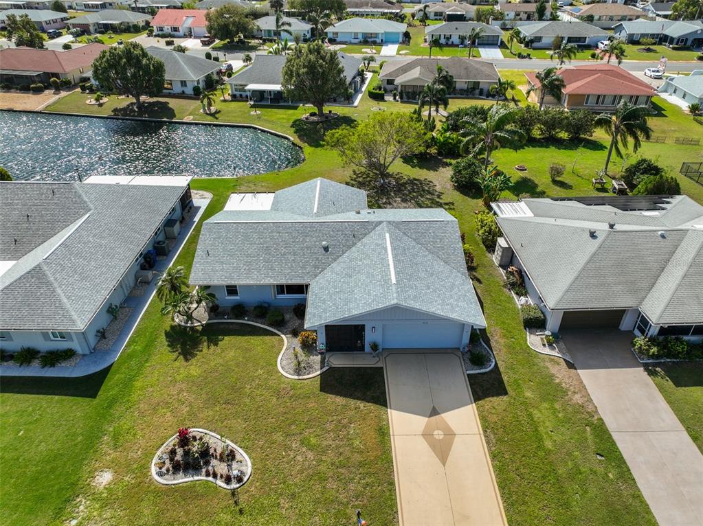 an aerial view of a house with swimming pool and outdoor space