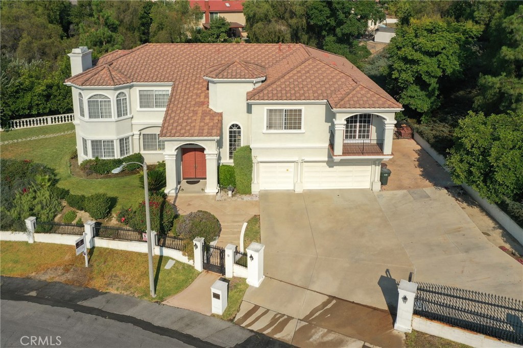 a aerial view of a house with swimming pool