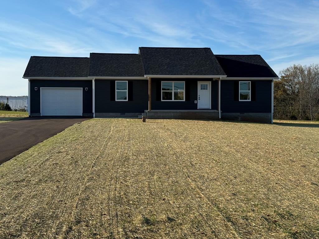 a front view of a house with yard