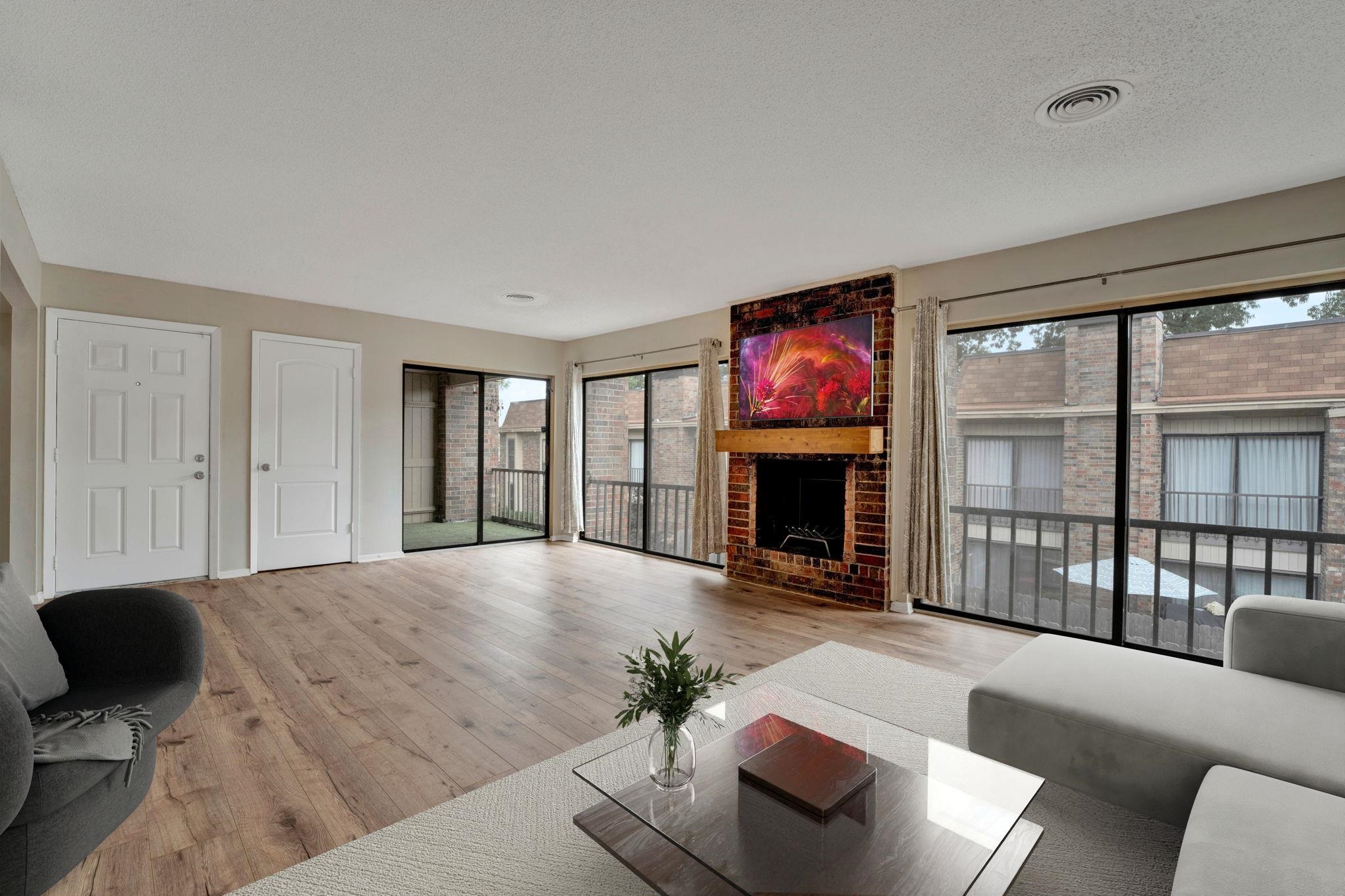 a living room with furniture window and fireplace