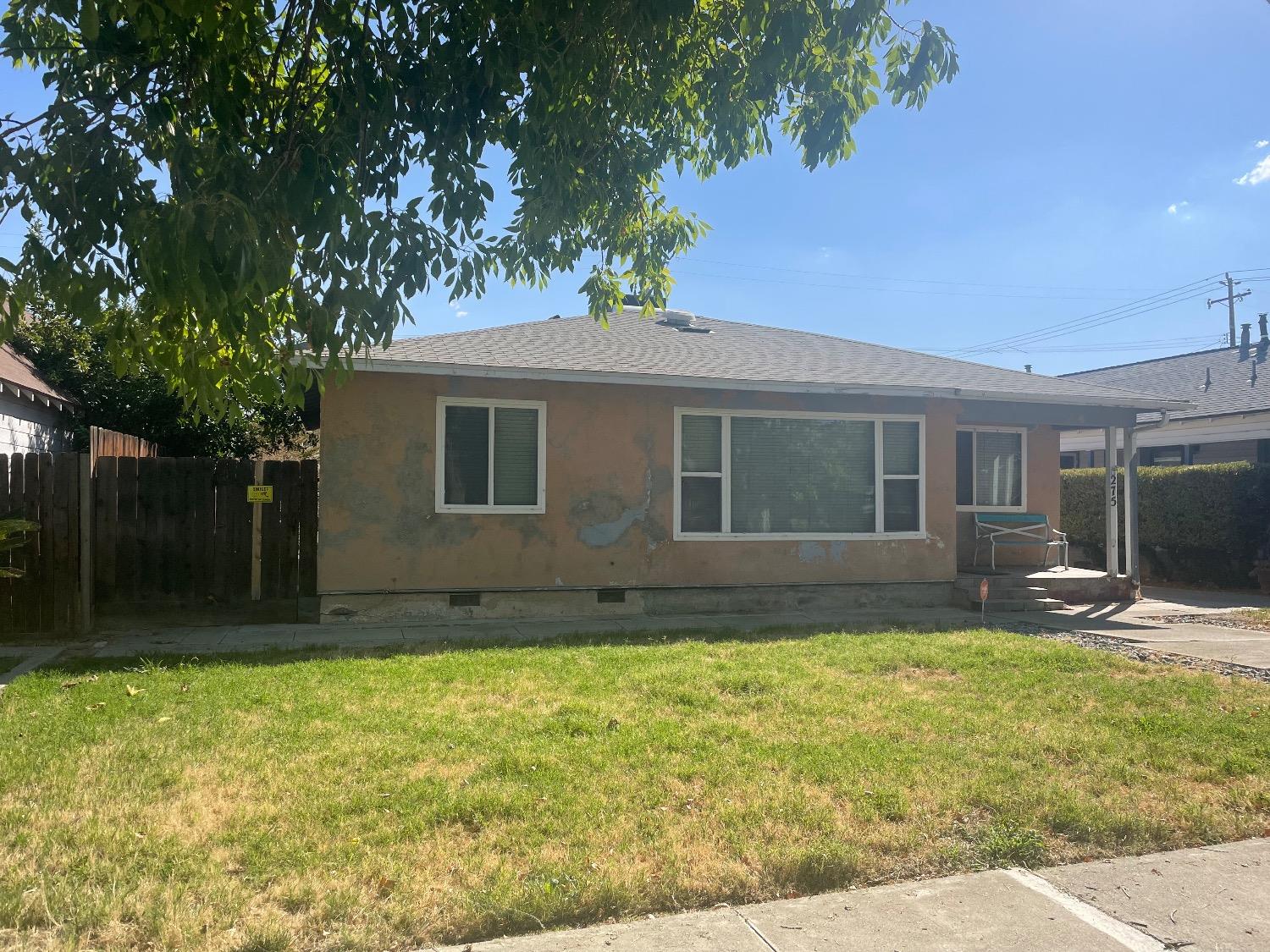 front view of a house with a yard