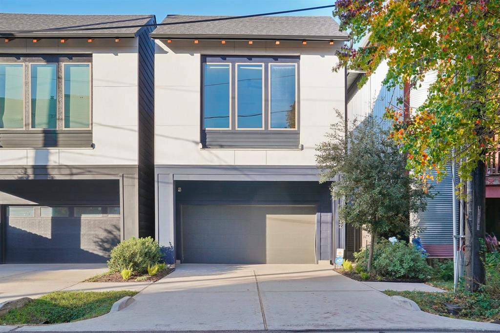 Discover this sleek 2 story, single family home with a contemporary facade, large windows, and a two-car garage. The tidy driveway and pristine landscaping enhance its inviting curb appeal.