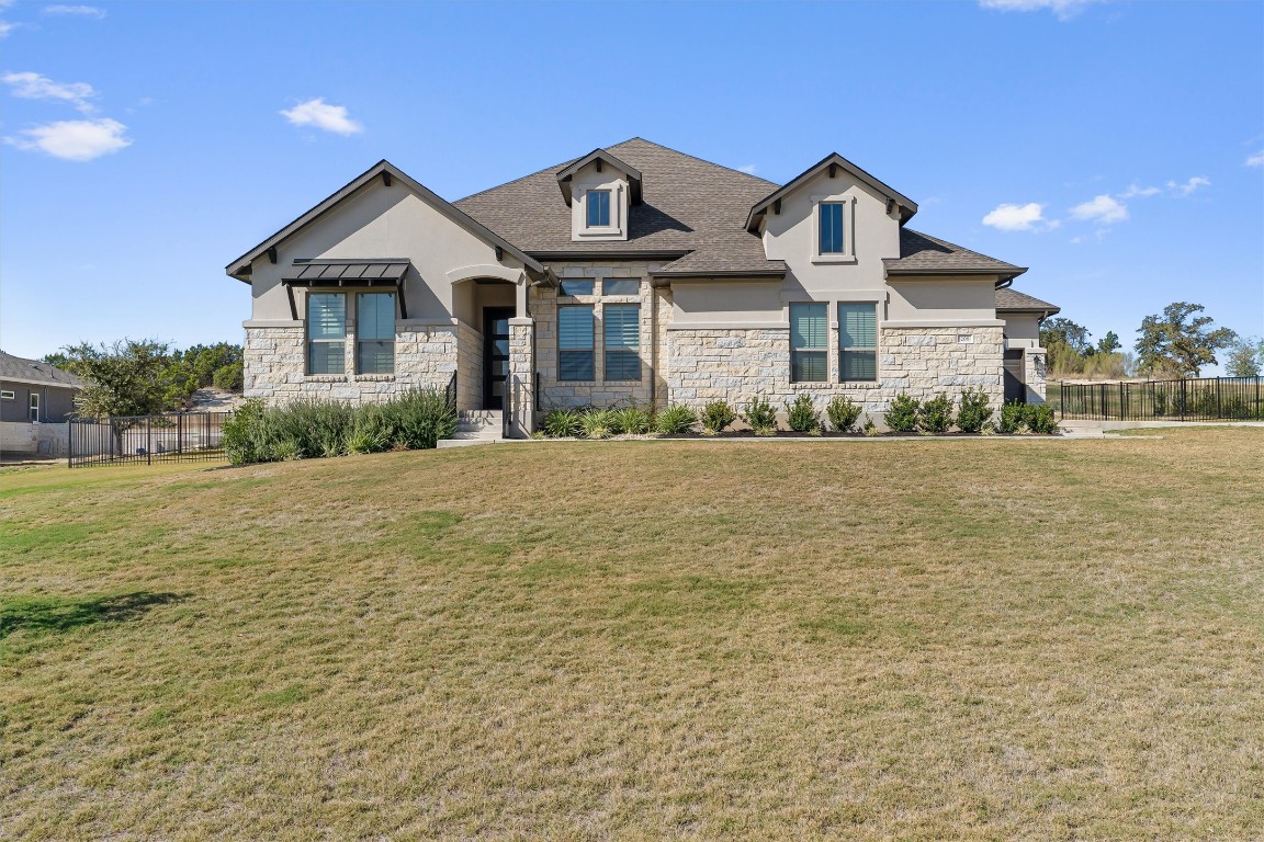 a front view of a house with a yard