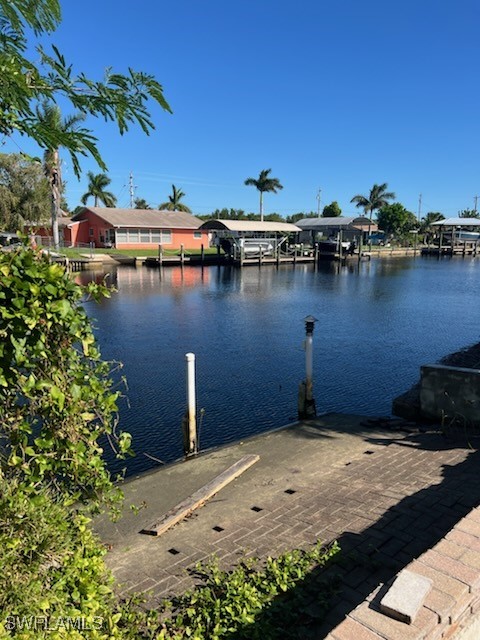 a view of a lake with boats and trees in the background