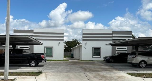 a view of a car park in front of house