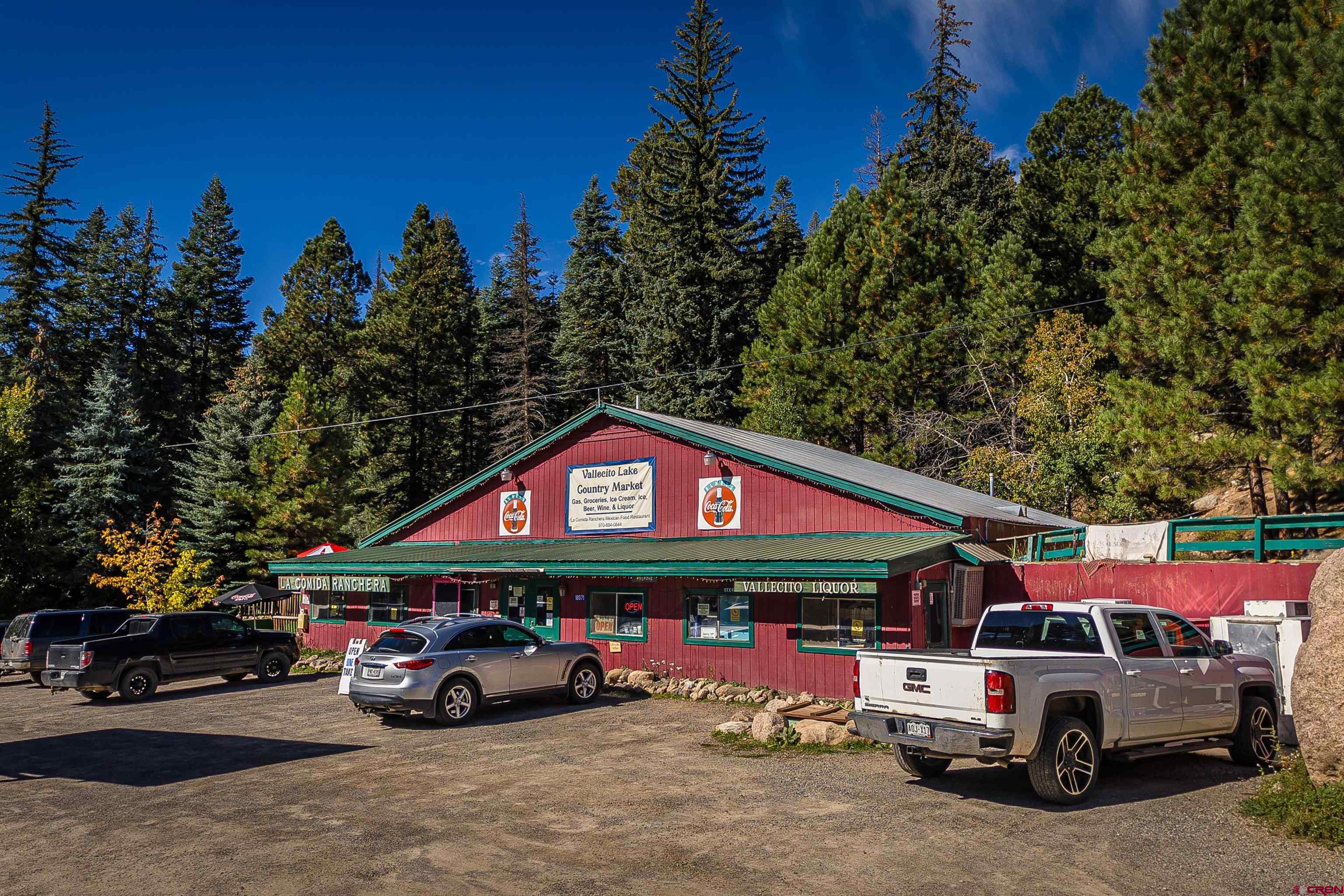 a view of a cars park in front of the house