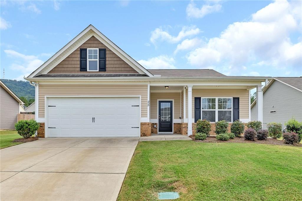 front view of a house with a yard