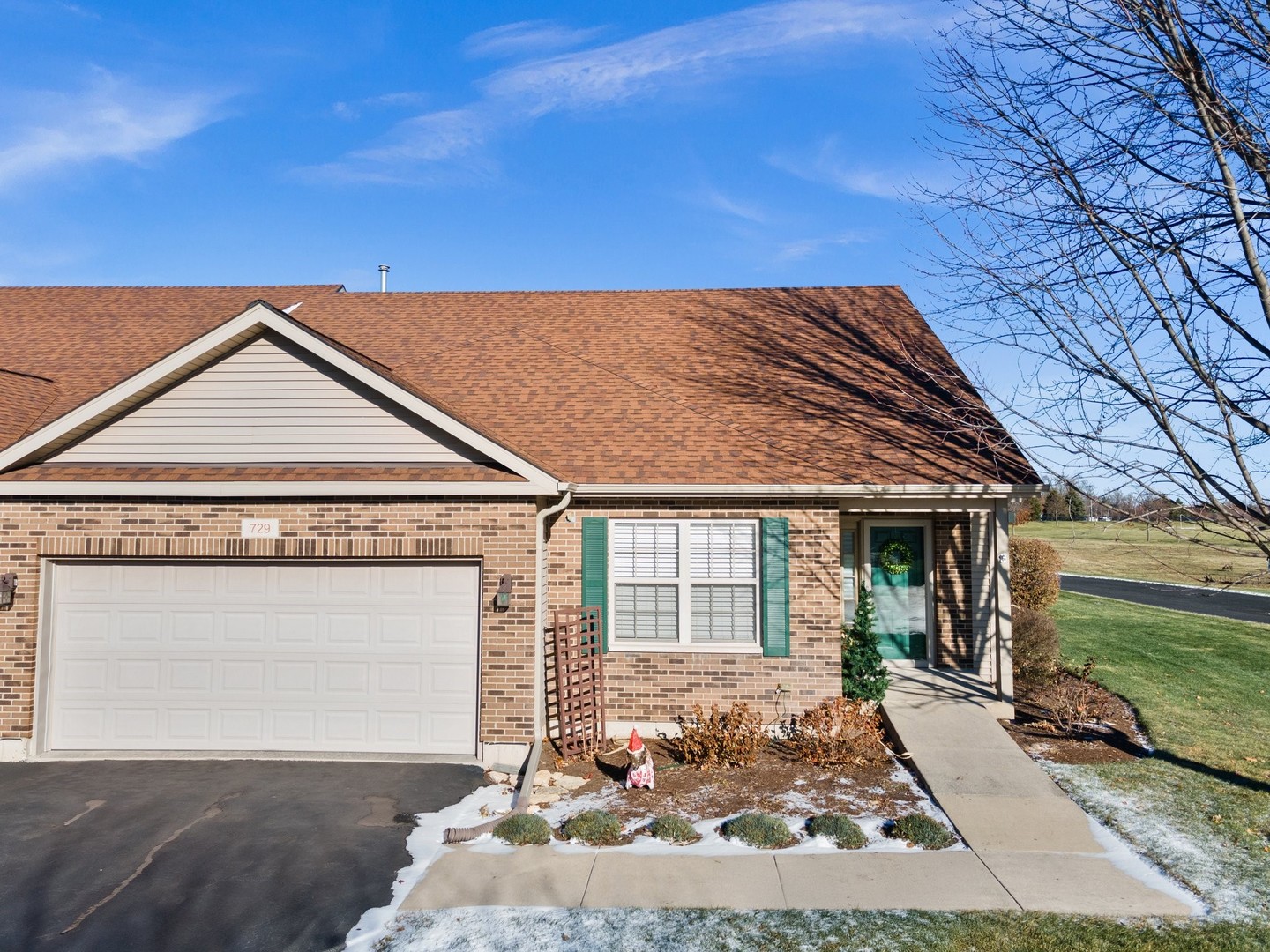 a front view of a house with a yard