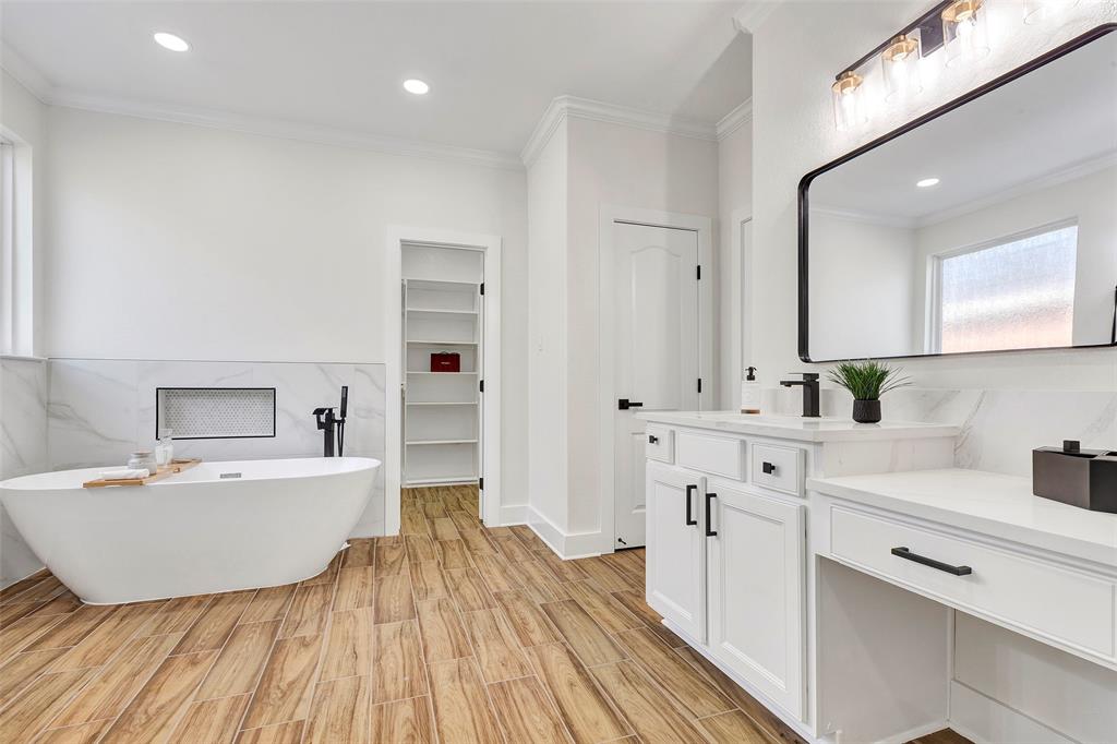 a view of a kitchen with sink dishwasher and a refrigerator