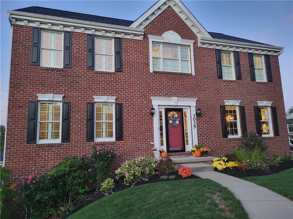 a front view of a house with outdoor and garden