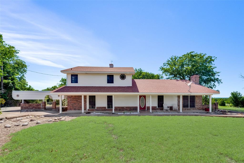 front view of a house with a yard