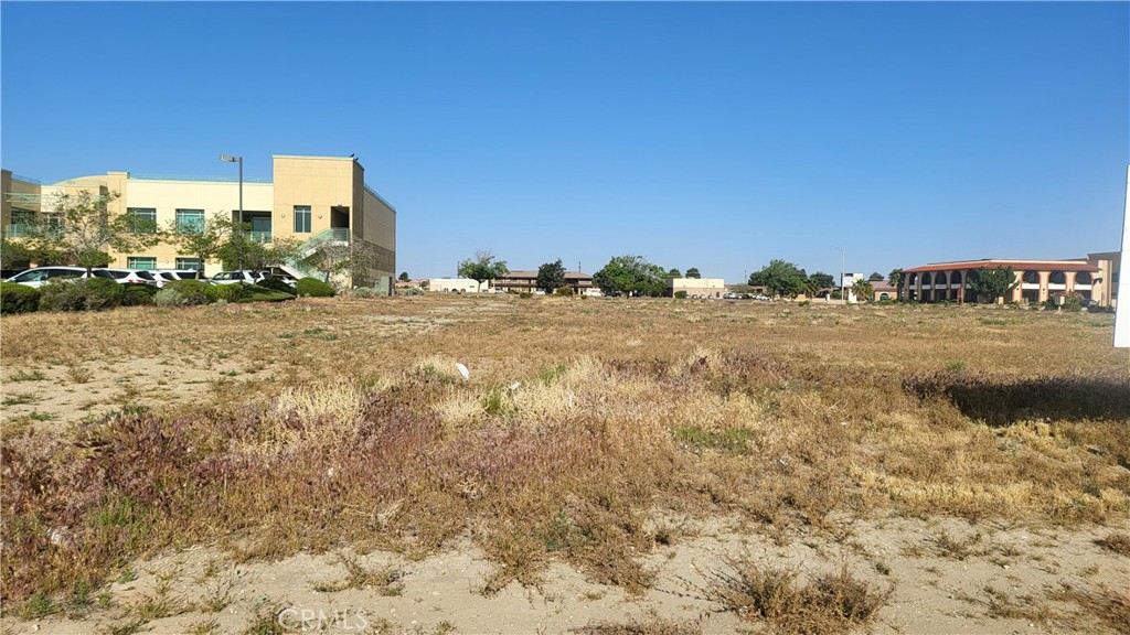 a view of a ocean with a building in the background