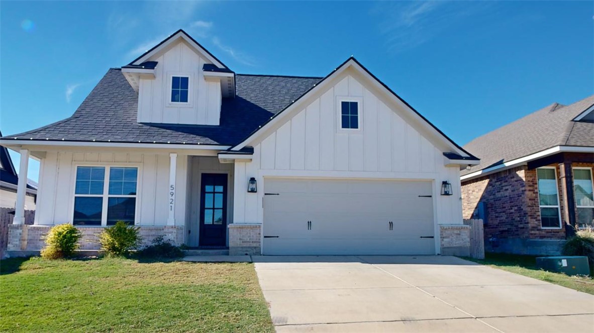 a view of a yard in front view of a house